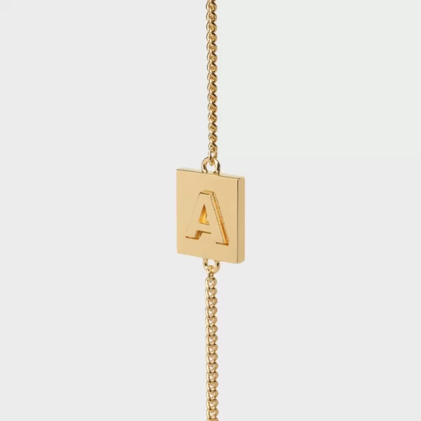 PULSERA ALPHABET CELINE CON LETRA A DE LATÓN CON ACABADO DORADO